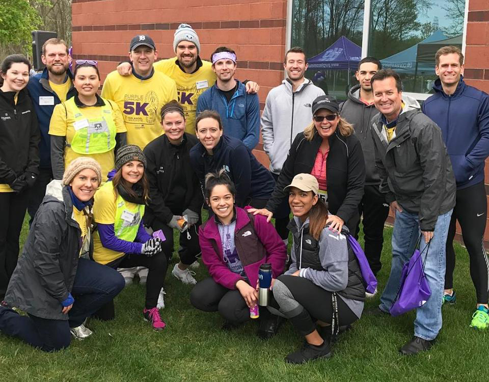 A group of people posing for a photo at a 5K fundraising run