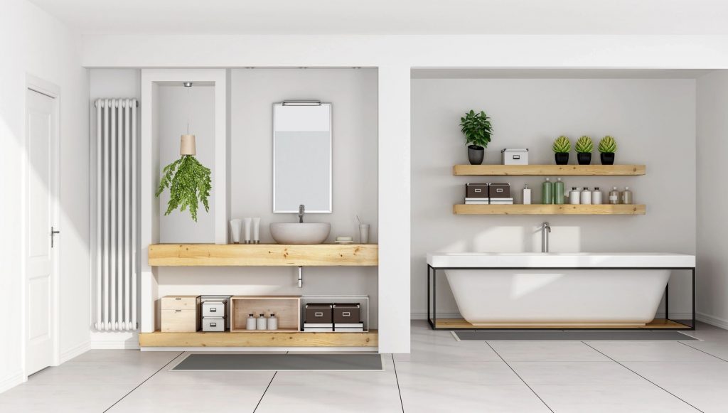 A bathroom with water basin-style sink, wood vanity and plants