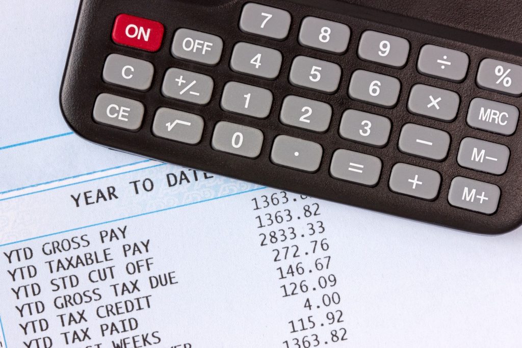 Close-up of a calculator on top of tax papers