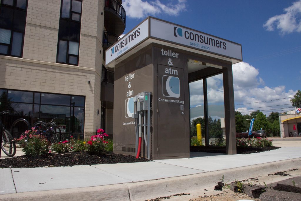 Angled side view of Consumers Credit Union Teller & ATM on a sunny day