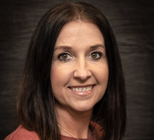 A woman smiling for a professional photo