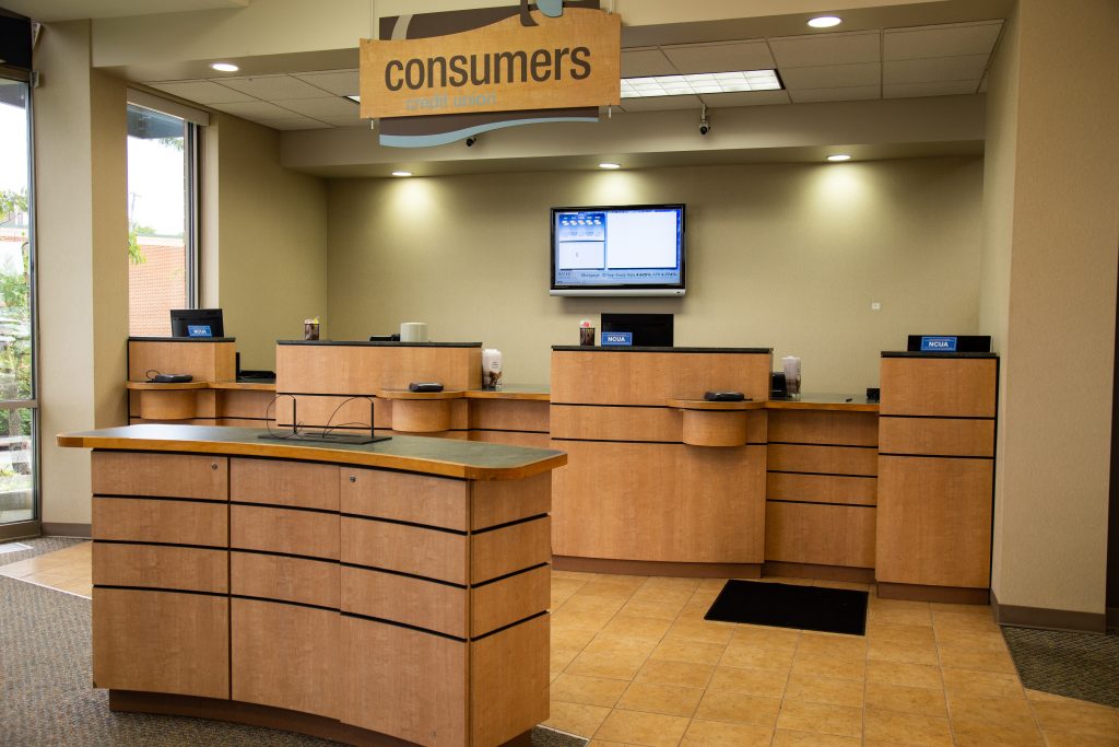 A Consumers Credit Union office front desk and withdrawal and deposit kiosk