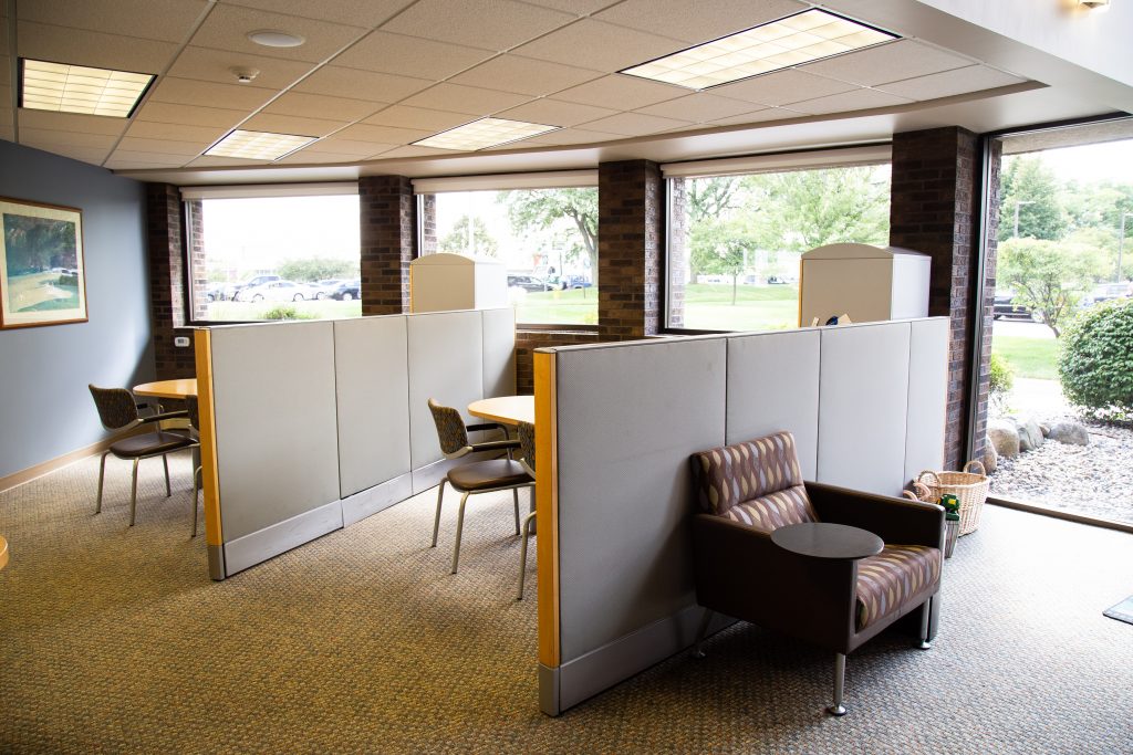 Office cubicles for financial counseling at a Consumers Credit Union office next to a waiting area