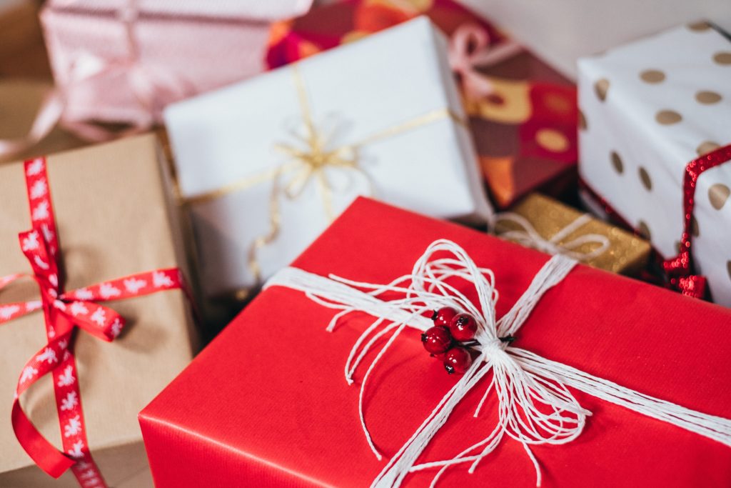 Photo of red, brown and white Christmas presents