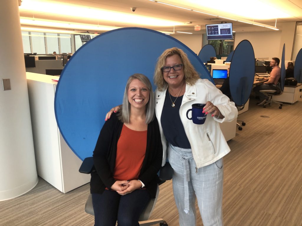 two women smile for the camera