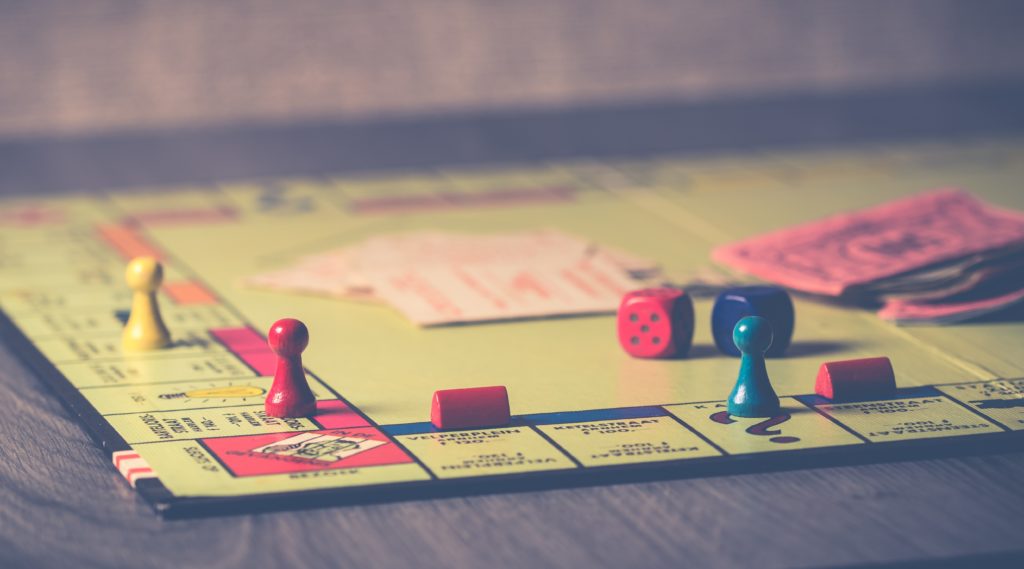 Monopoly board game on brown wooden tabletop