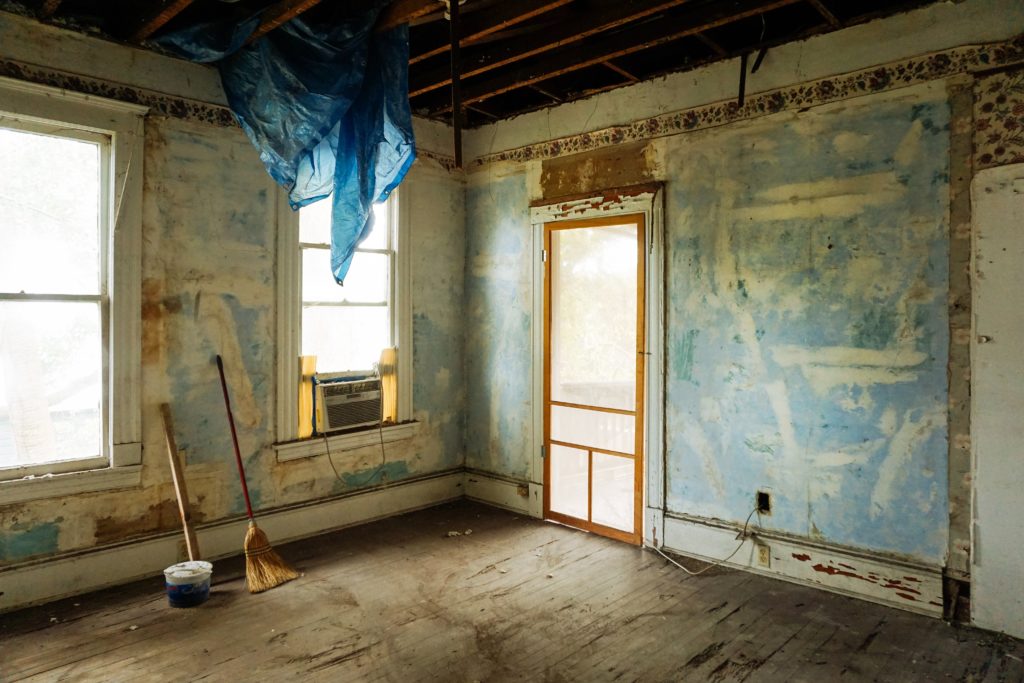 Interior of house stripped to floor and drywall